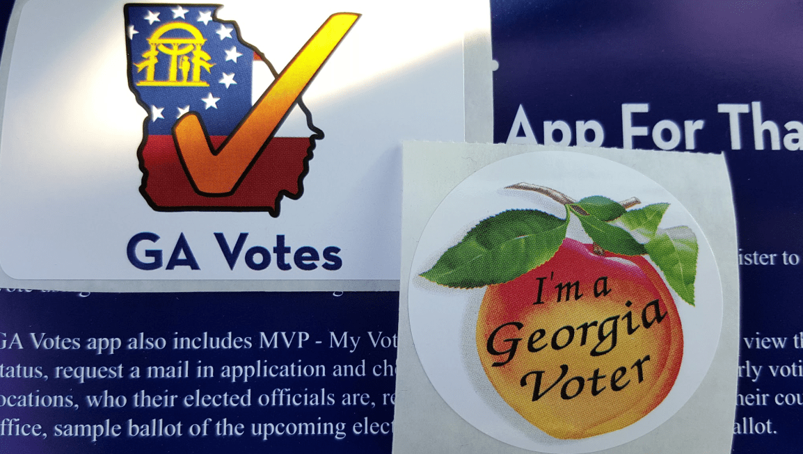 Photograph of two stickers for people that have voted in Georgia